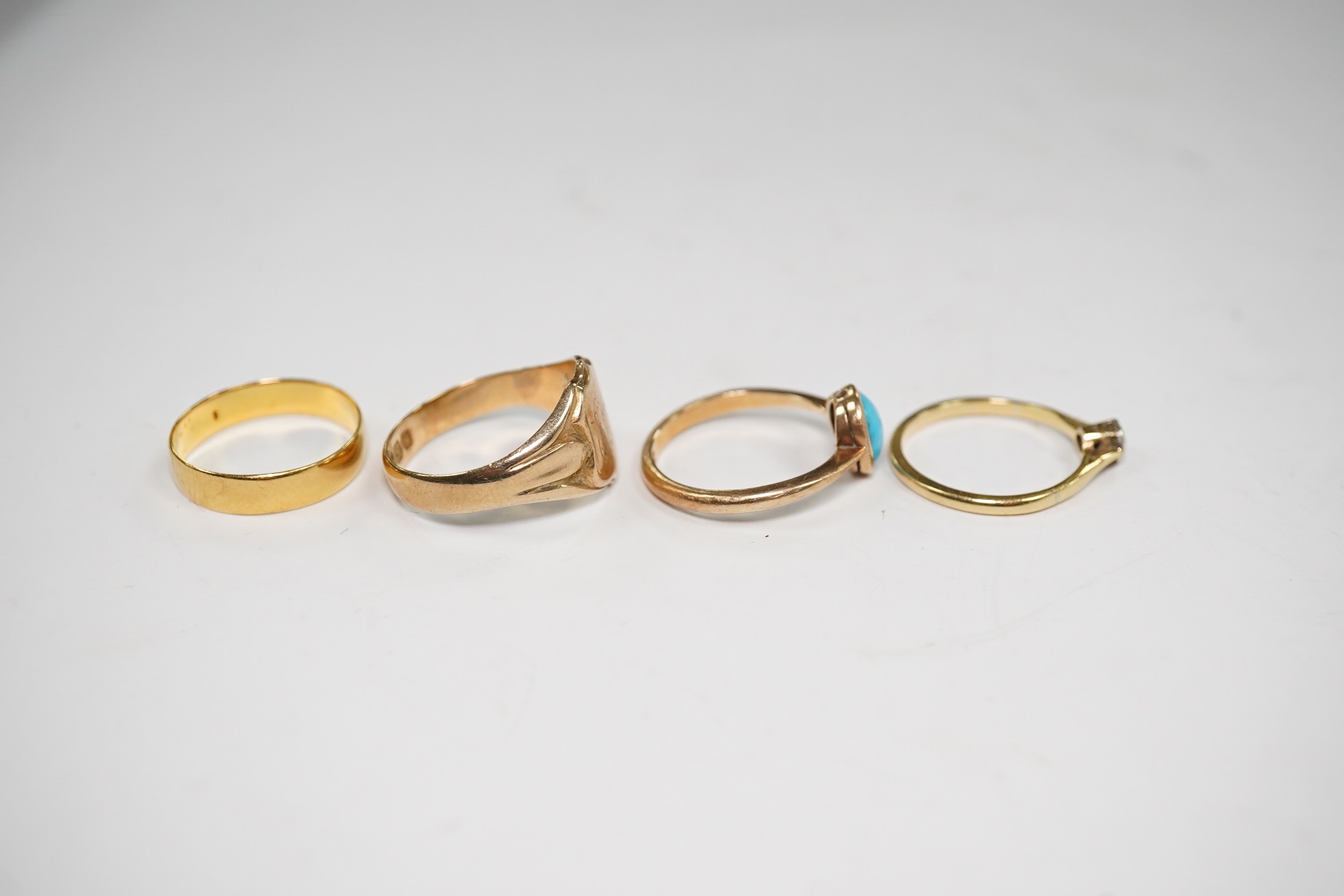 A 22ct gold wedding band, 2.6 grams, a yellow metal and solitaire diamond set ring and two 9ct gold rings including a signet ring, gross weight 9.3 grams. Condition - poor to fair